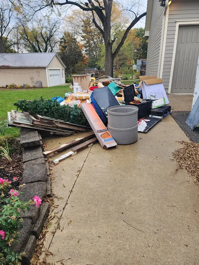 Dumpster being loaded with debris for Estate Cleanout Dumpster Rental in Westover